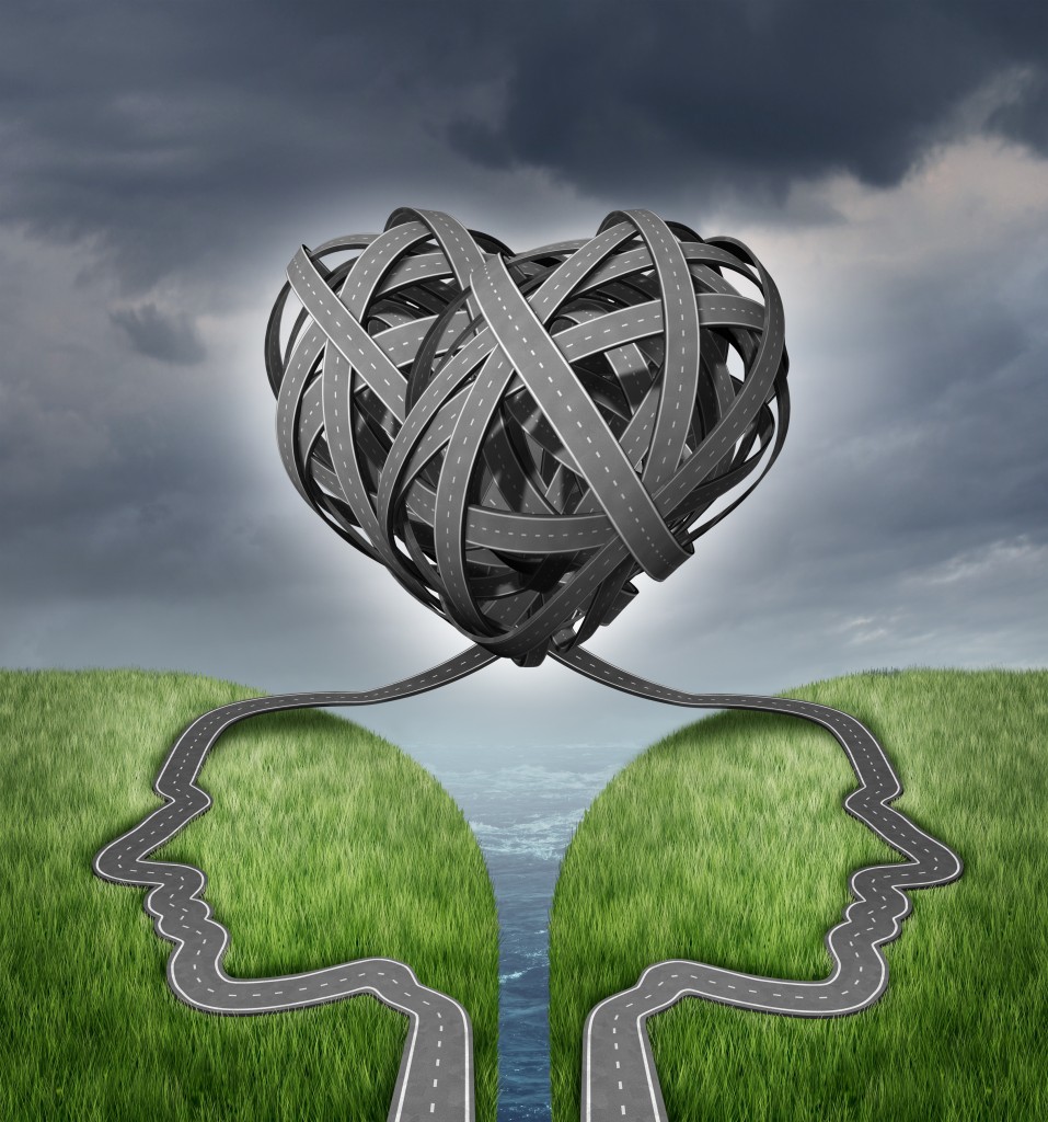 Relationship direction and couple crisis as a social or sexual concept for marriage counseling with a group of two tangled roads or highways shaped as human heads on a cliff in a shape of a heart.